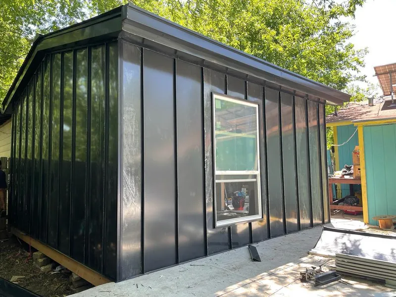 Black standing seam metal wall panels for Roof Inspection in Northlake