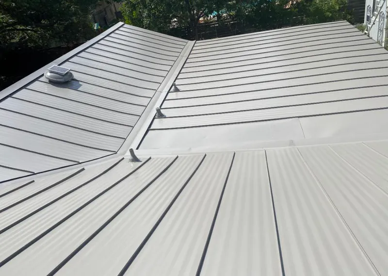 Solar attic fan installed on a metal roof for Roof Ventilation in Northlake